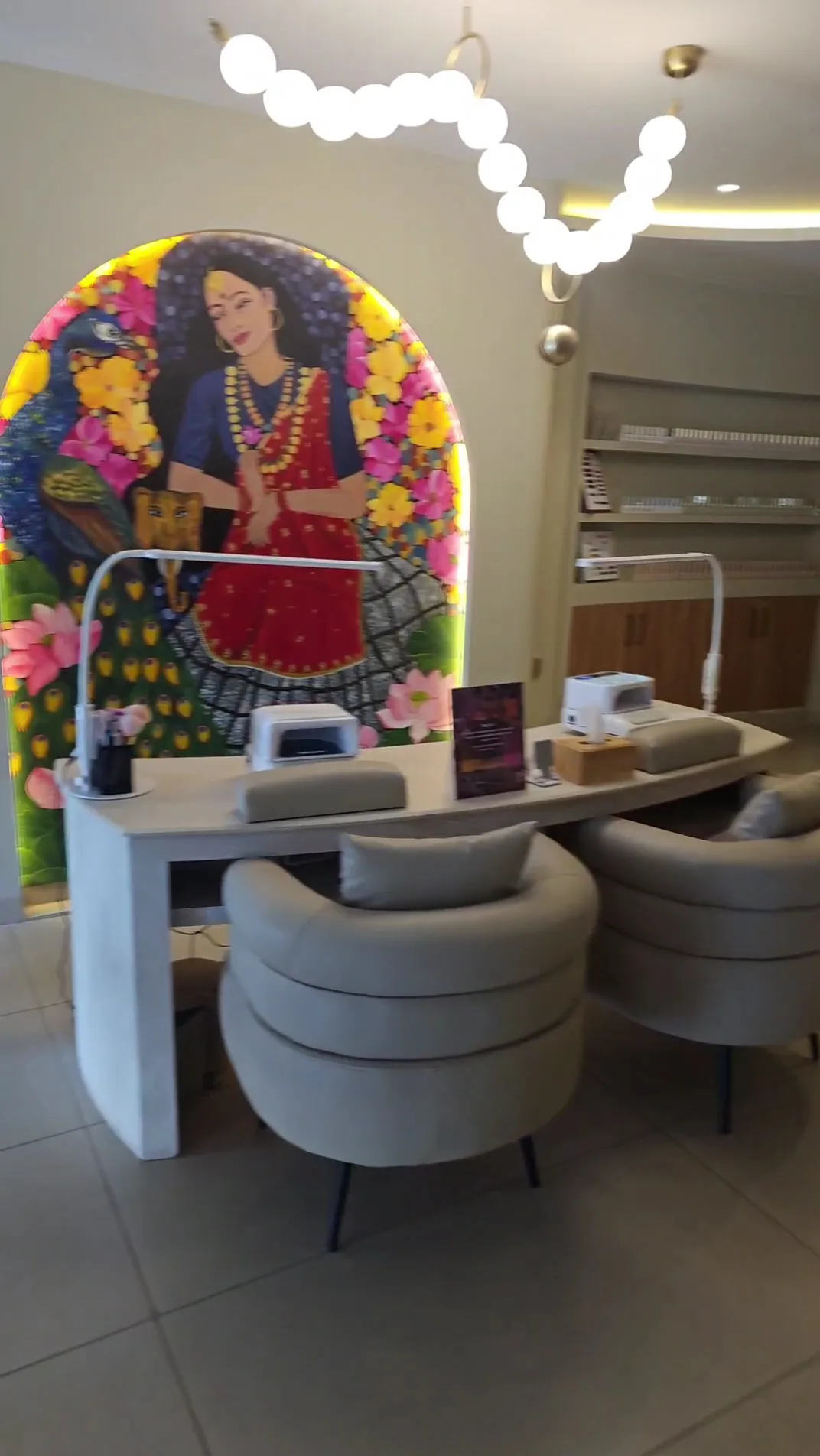 Reception desk with artwork at LashXtend Pokhara